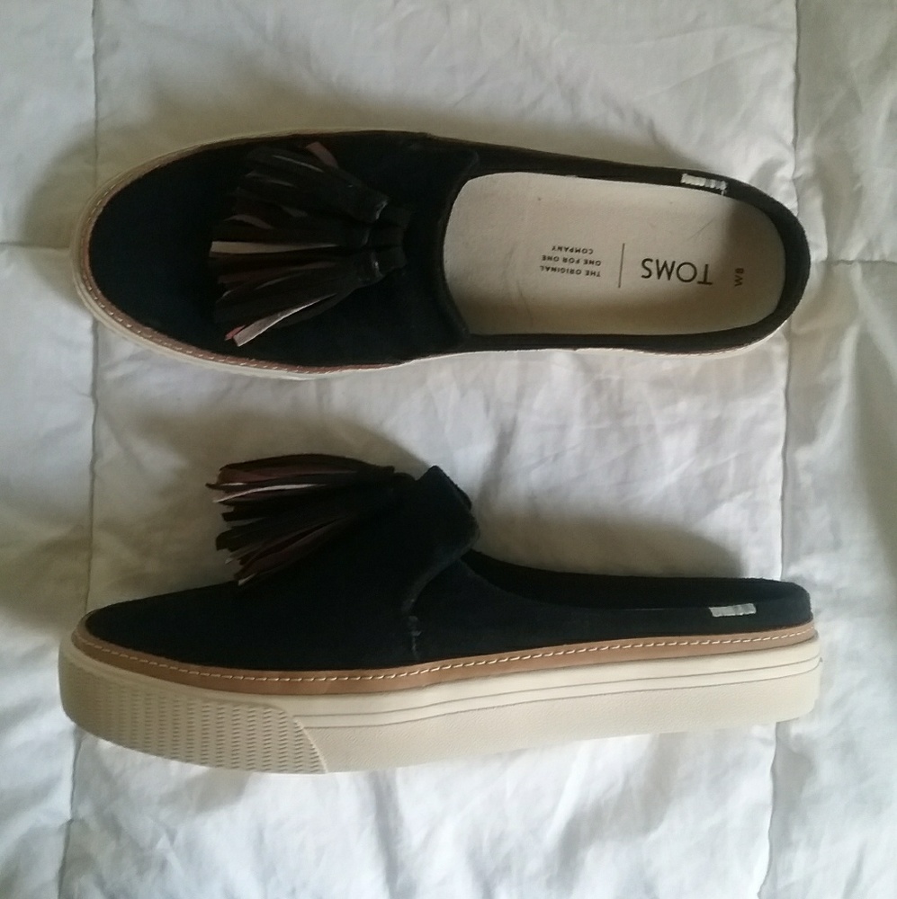 Black Slip on Toms with tassels.